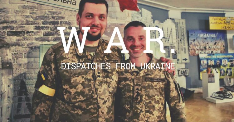 Kyiv territorial defense servicemen Andriy Kovaliov and Yuriy Myronenko at the opening of the exhibition 