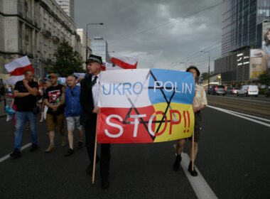 Far-right marchers in Warsaw carry an anti-Ukrainian banner reading UKRO POLIN STOP over merged Polish and Ukrainian flags